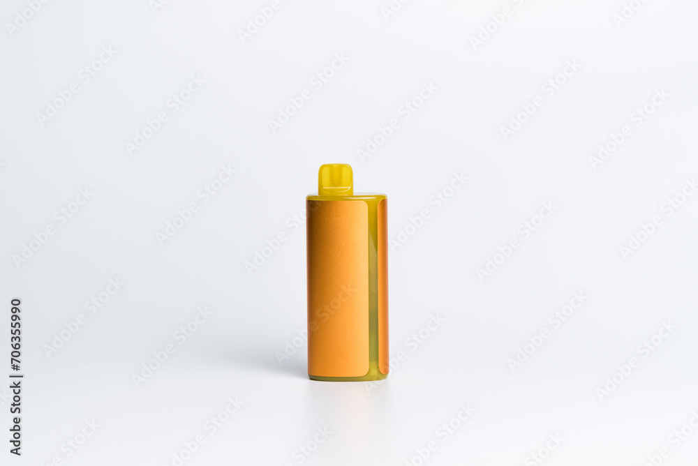 Orange vape or pod system on a white background. Orange vape or pod system on a white background.