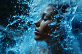 Athletic female figure surrounded by splashes of water, close up portrait, concept of variability, freedom, energy, freshness.
