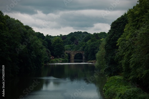 Overcast Elegance: The River's Ancient Crossing