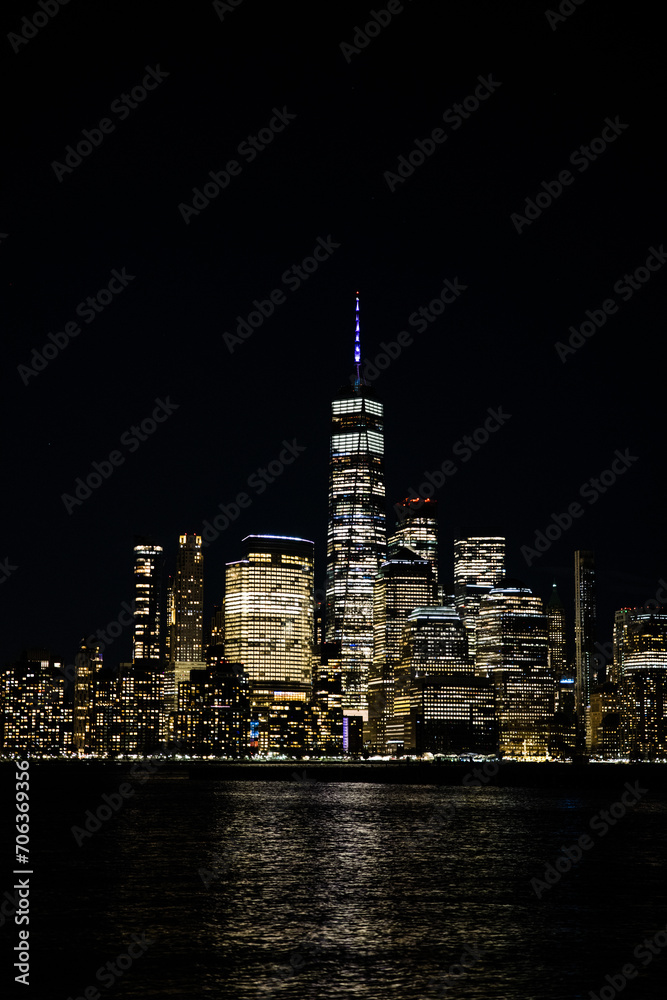 Stunning view of the New York City skyline at night, beautifully illuminated by lights