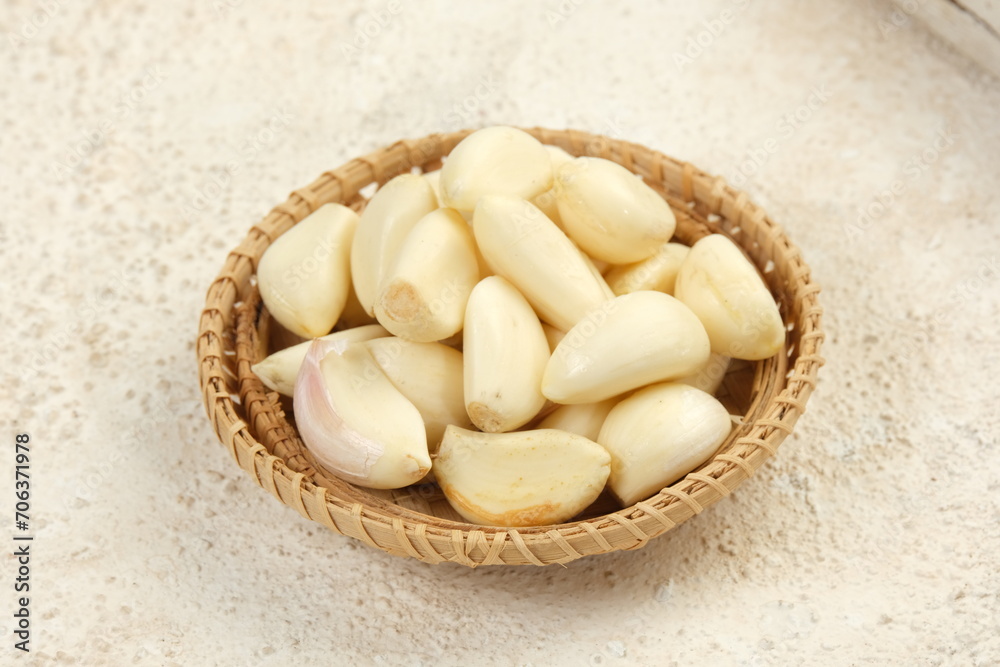 bawang putih kupas or peeled garlic on white background bawang putih kupas or peeled garlic on white background