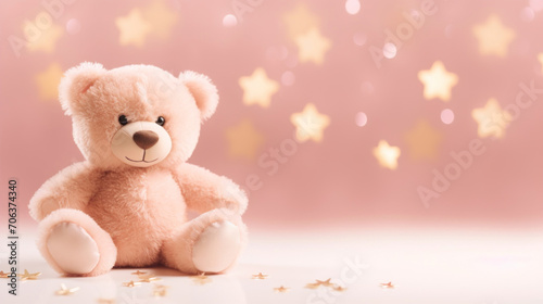 Cute teddy bear sitting with sparkling golden stars in a dreamy pink background, perfect for children. © tashechka