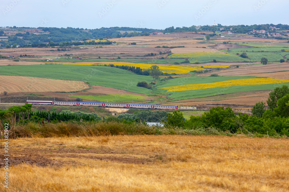 Trakya Region train line and a train passing through sunflower fields