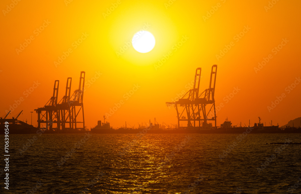 Silhouette of a cargo port image , Cargo ports are facilities that are used to load and unload cargo from ships