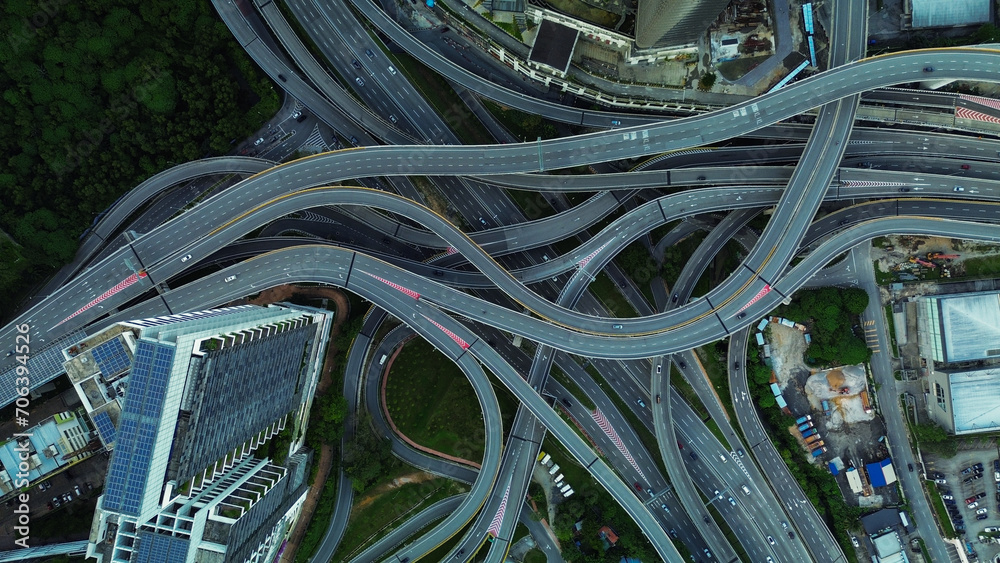 Aerial view of the expressway in Malaysia in the city of Kuala Lumpur, Penchala link. A birds eye view of a confusing traffic intersection. Architecture and urban planning of the capital.