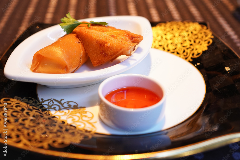 Chinese spring rolls and deep-fried bread with shrimp paste made by a chef of an authentic Chinese restaurant Chinese spring rolls and deep-fried bread with shrimp paste made by a chef of an authentic Chinese restaurant
