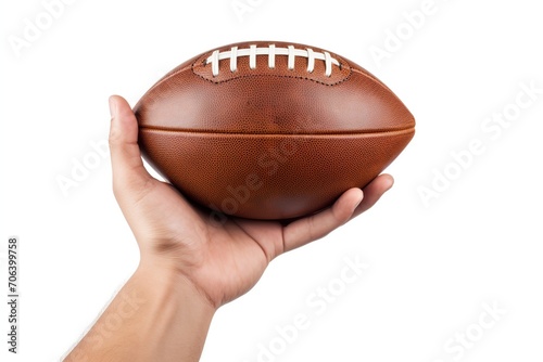 Leather american football ball in male hand on white background © Alina