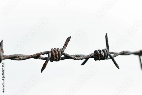 A detailed view of a barbed wire fence. Suitable for illustrating concepts such as security, danger, or boundaries.