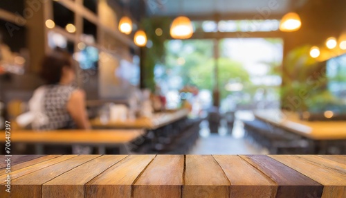 Brewed Beauty: Blur of a Coffee Shop Behind an Inviting Empty Wooden Table