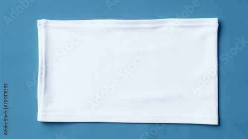 white paper on blue, Blank white laundry care clothes label on blue fabric texture background, Ai generated image 
