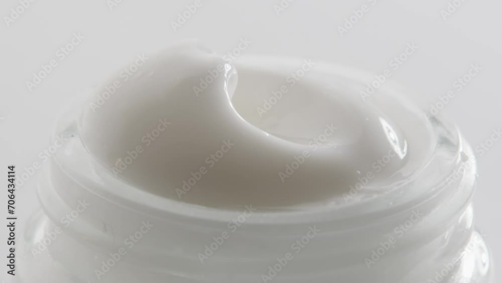 Cosmetic white cream texture closeup day night Cosmetic white cream texture closeup day night