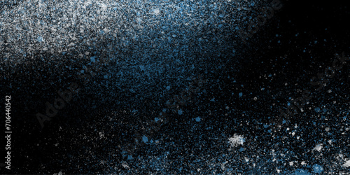 Sky blue Black splatter splashes water ink spray paint.glitter art powder on,wall background spit on wall liquid color aquarelle painted cosmic background splash paint.

