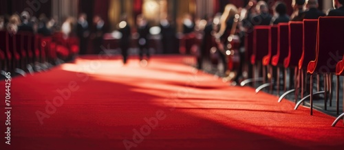 Musicians outside, closeup view of a red carpet.