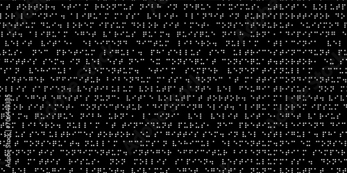 Texture of round holes of braille text on a black background. Seamless pattern of code symbols. International alphabet for the blind. photo