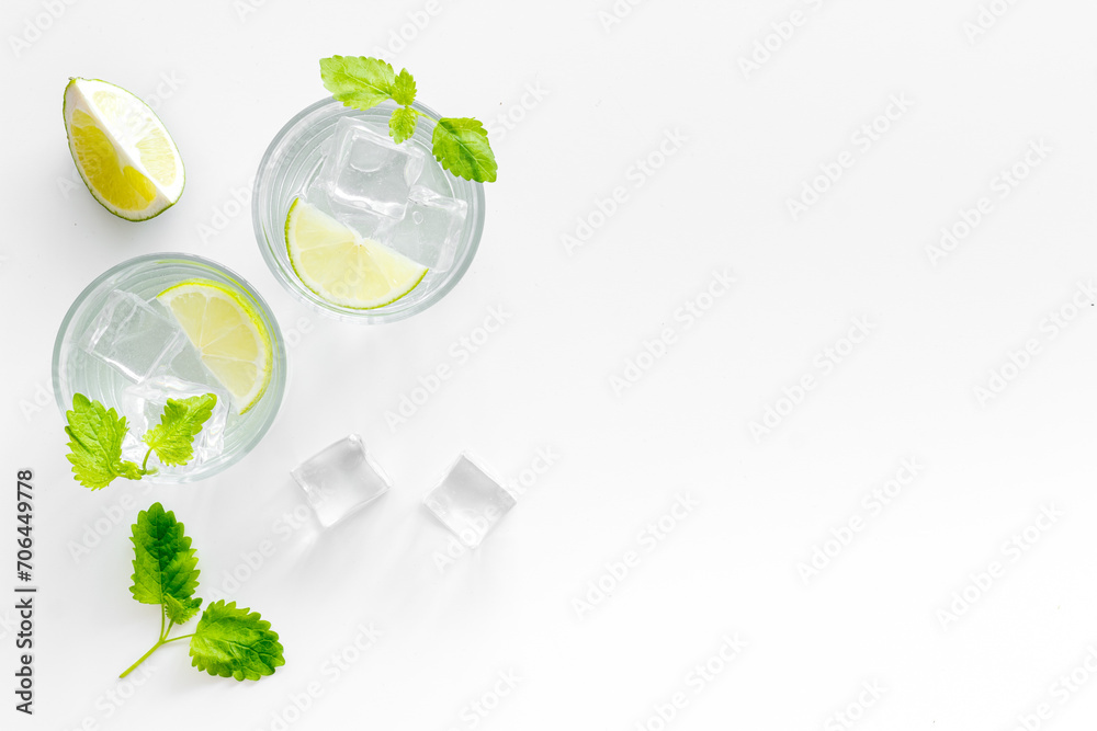 Refreshing cocktail mojito with mint and ice cubes in glasses, top view Refreshing cocktail mojito with mint and ice cubes in glasses, top view