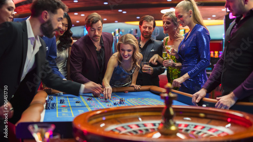 Footage of a Spinning Roulette Wheel. Female and Male Guests Placing Risky Bets while Playing Roulette. Crowd Celebrating a Positive Outcome and Cheering the Winners