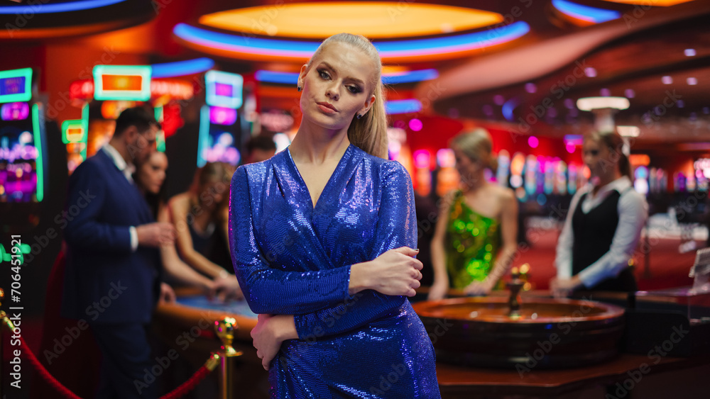 In a Modern Casino Setting: Gorgeous Caucasian Blond Woman Posing Confidently, Looking at Camera, Modeling in a Striking Dress for Advertising or Commercial Materials for a Gambling Industry