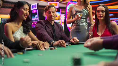 Diverse Group Playing Poker in a Luxurious Casino, Strategically Betting. High-Stakes, Focused Gamblers Analyzing Moves, Tension Rising on a Competitive Gambling Championship. 