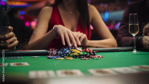 Anonymous Glamorous Woman in a Evening Dress Collecting her Prize of Poker Chips in a Luxury Casino. Lucky Female Winner Hitting the Jackpot, Happy and Rich