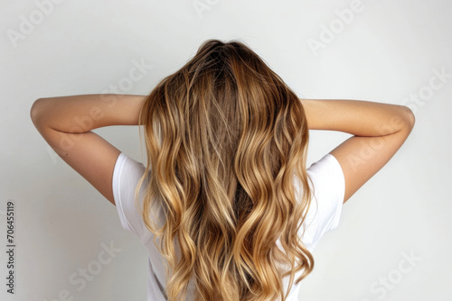 Woman Showcasing Balayage Hair On White Background