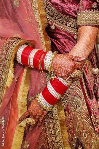 Closeup of hand of indian bride wearing beautiful bangles