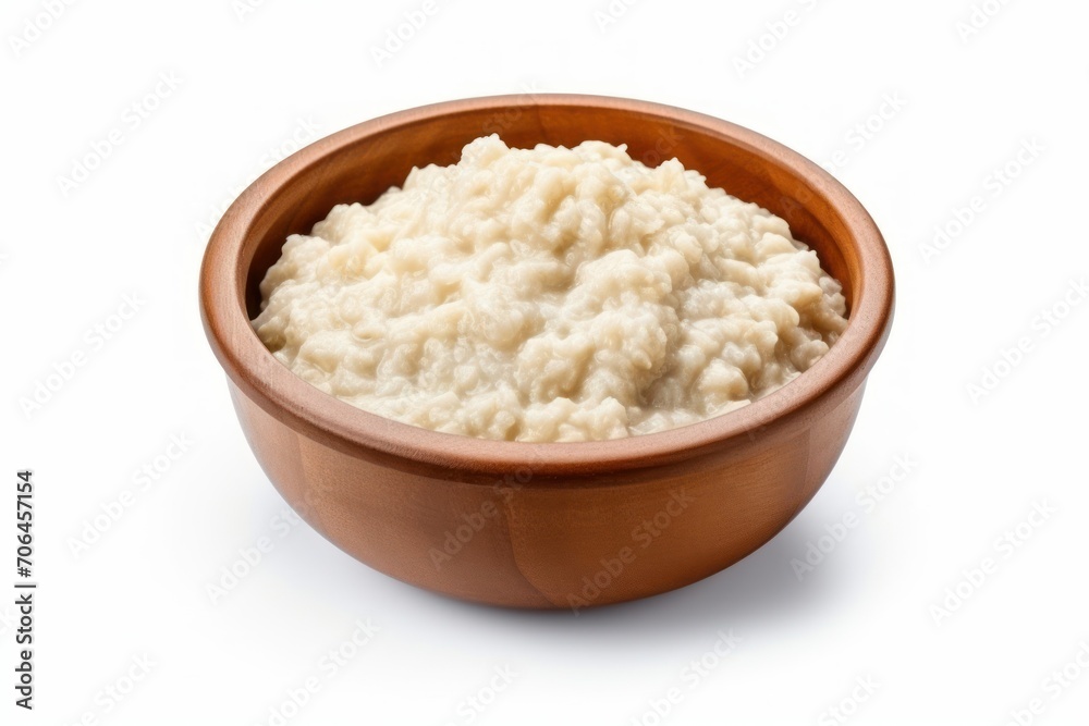 Delicious plain boiled oatmeal in a bowl isolated on white Delicious plain boiled oatmeal in a bowl isolated on white