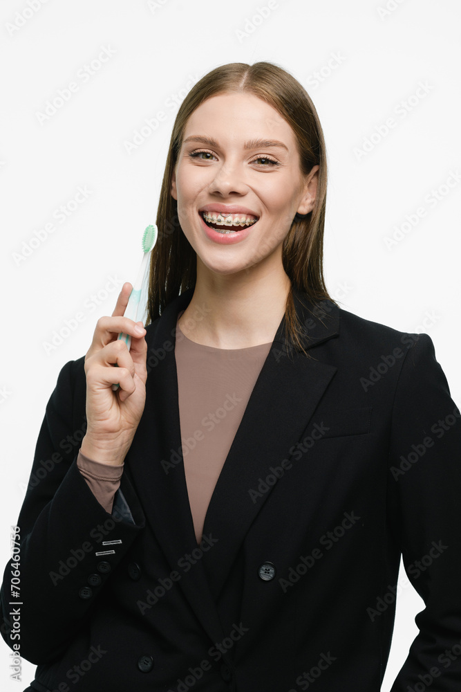Young beautiful woman with toothbrush isolated on white background Young beautiful woman with toothbrush isolated on white background