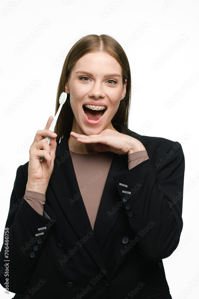 Young beautiful woman with toothbrush isolated on white background Young beautiful woman with toothbrush isolated on white background