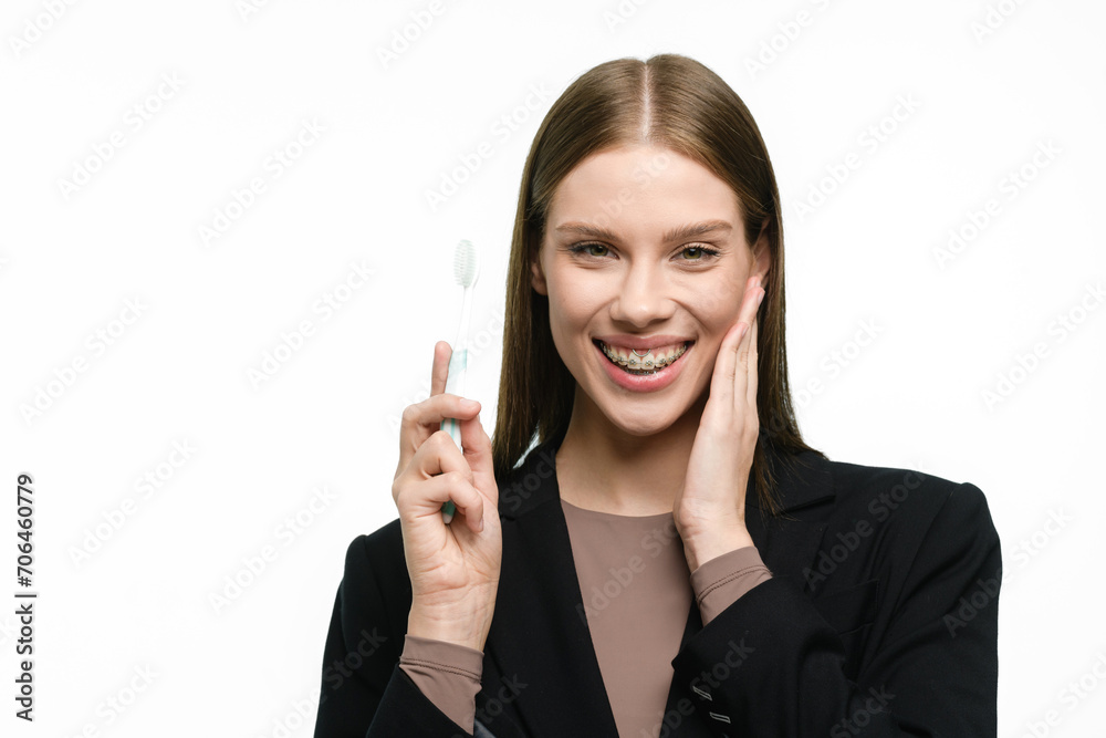 Young beautiful woman with toothbrush isolated on white background Young beautiful woman with toothbrush isolated on white background