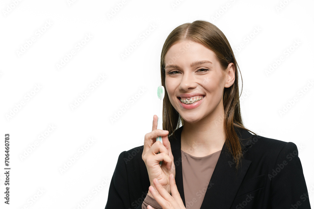 Young beautiful woman with toothbrush isolated on white background Young beautiful woman with toothbrush isolated on white background