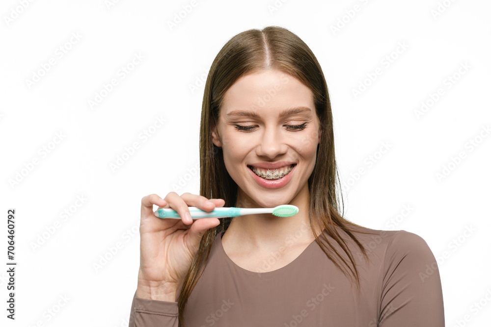 Young beautiful woman with toothbrush isolated on white background Young beautiful woman with toothbrush isolated on white background