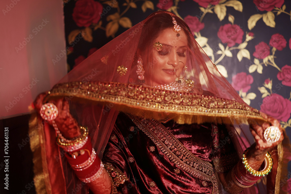 Portrait of indian bride covered face from dupatta