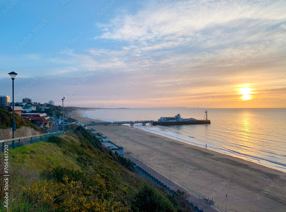 A scenic morning sunrise over Bournemouth pier in the English Channel. 