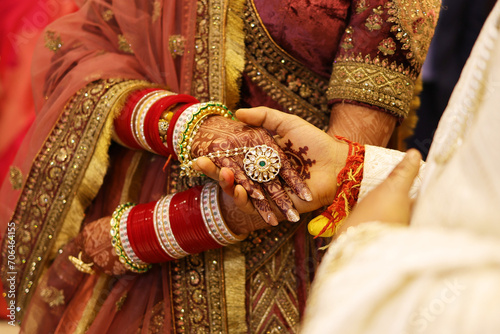 Groom hand in bride hand in indian wedding
