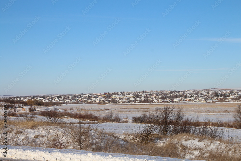 A landscape with snow and trees