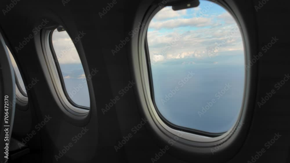 View of a cloudscape from an airplane window View of a cloudscape from an airplane window