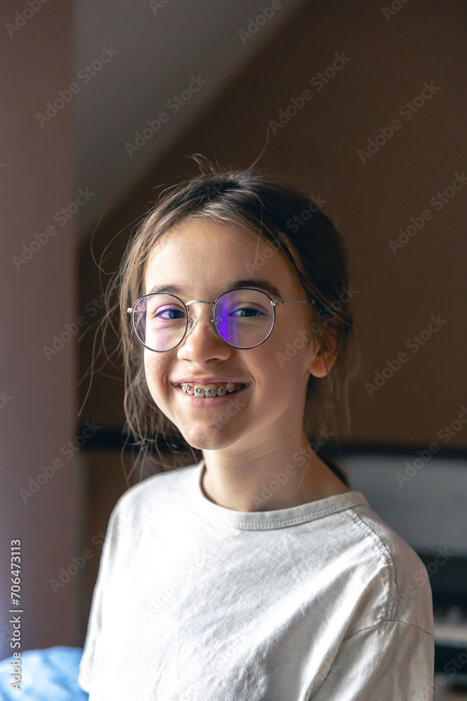 Portrait of a teenage girl with glasses and braces. Portrait of a teenage girl with glasses and braces.