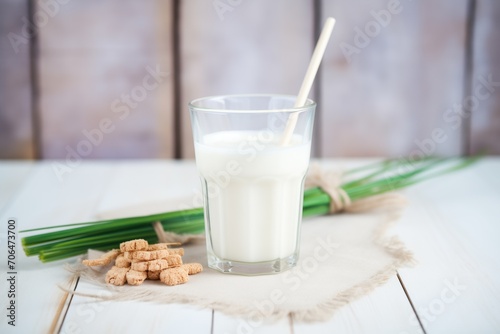 glass of kefir with a biodegradable straw, eco-friendly concept