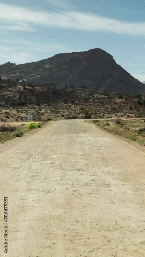 driving in atlas mountains, morocco in vertical driving in atlas mountains, morocco in vertical