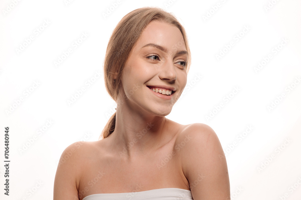 Beauty portrait of a pretty blonde girl posing on an isolated white background. Skin care concept Beauty portrait of a pretty blonde girl posing on an isolated white background. Skin care concept