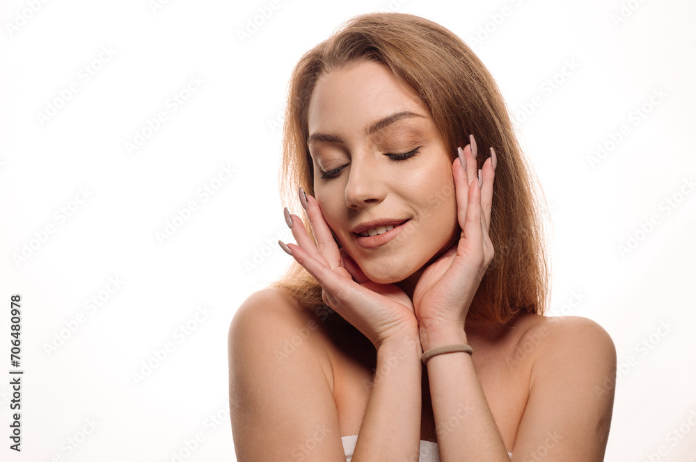 Beauty portrait of a pretty blonde girl posing on an isolated white background. Skin care concept Beauty portrait of a pretty blonde girl posing on an isolated white background. Skin care concept