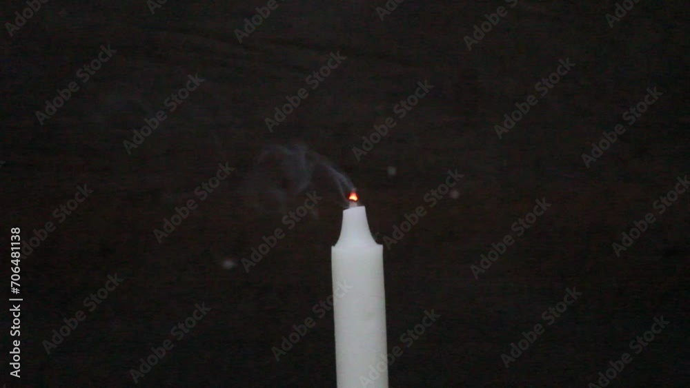 Light smoke form extinguished candle, dark background Light smoke form extinguished candle, dark background