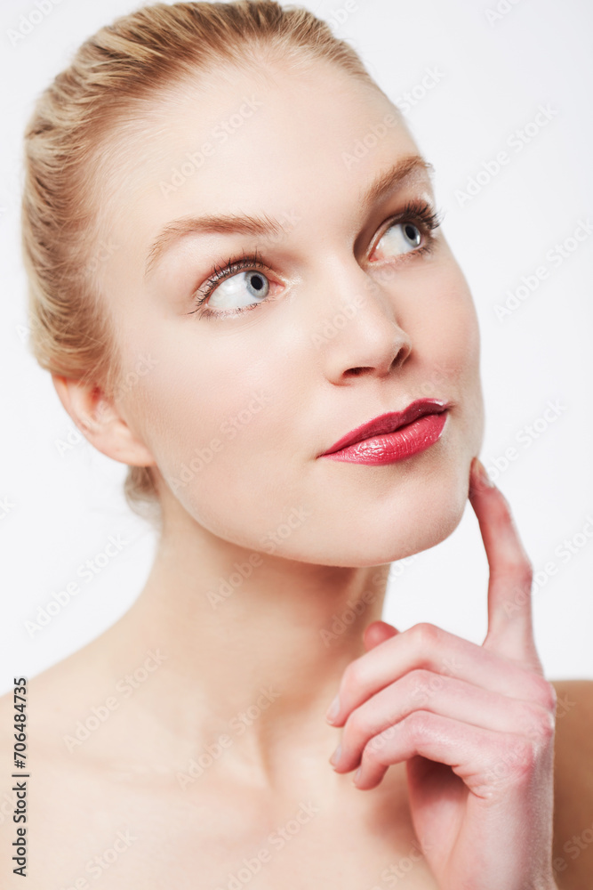 Thinking, skincare and woman in red lipstick, makeup and cosmetics in studio isolated on a white background. Face, model and beauty in spa facial treatment for wellness, touch skin and healthy glow Thinking, skincare and woman in red lipstick, makeup and cosmetics in studio isolated on a white background. Face, model and beauty in spa facial treatment for wellness, touch skin and healthy glow