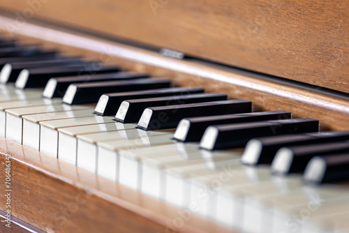 Close-up  keys of an antique wooden piano.