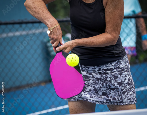 Pickleball player hits a volley during tournament