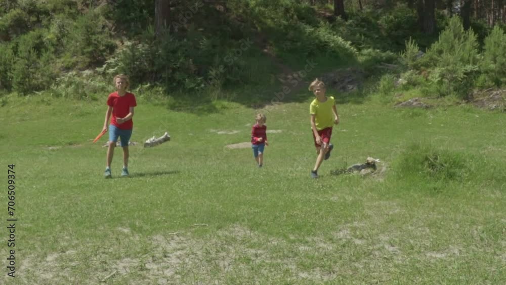 Happy boys runing in mountain river bank on a Sunny summer day. Slow motion. Children playing Outside by the river.
The concept of friendship, peace, kindness, childhood.