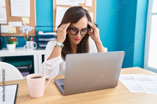 Young beautiful hispanic woman business worker stressed working at office