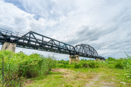 Beautiful scenic of black steel railway bridge across the river © Phatara Thitiwimol