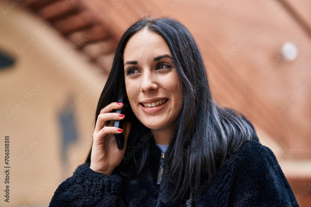 Young caucasian woman smiling confident talking on smartphone at street Young caucasian woman smiling confident talking on smartphone at street