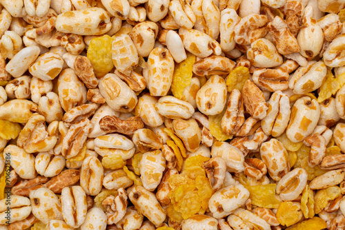 Background and texture of wheat flakes and puffed corn.